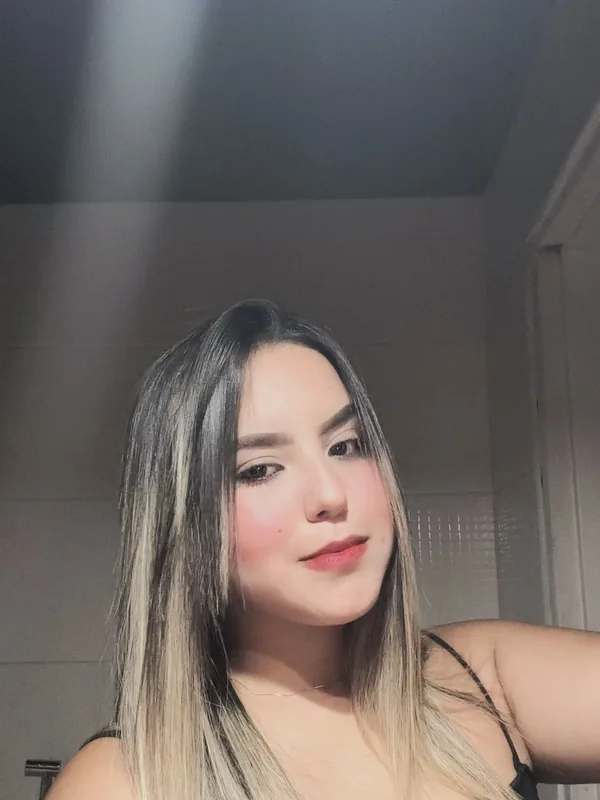 Woman with highlighted hair smiling